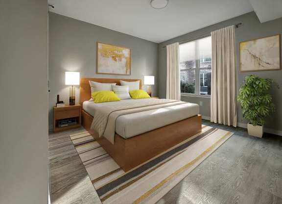 A bedroom with a large bed and a plant.