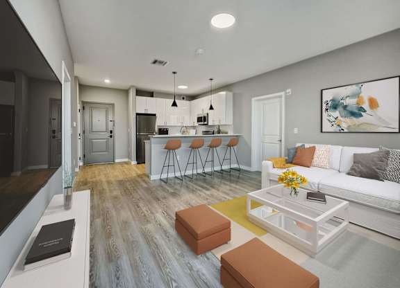 A modern living room with a kitchen in the background.
