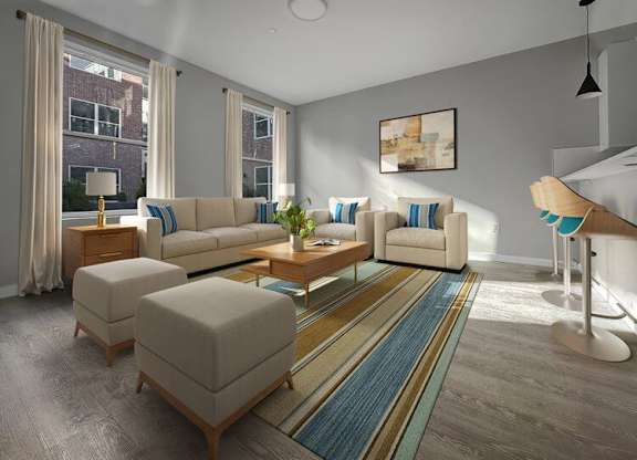 A living room with a white couch and a wooden coffee table.
