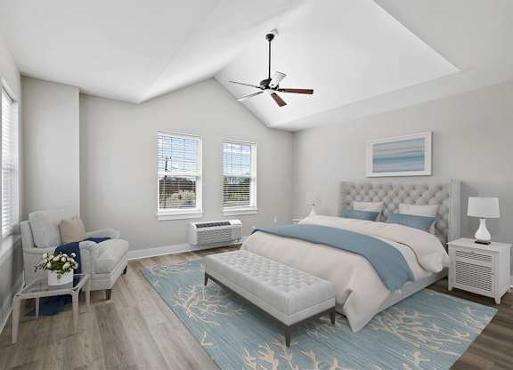 A bedroom with a large bed and a ceiling fan.