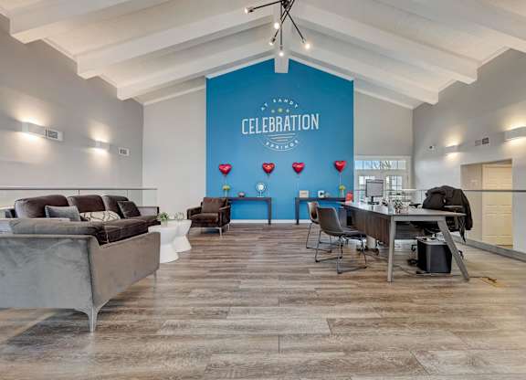 A room with a blue wall and a sign that says "CELEBRATION" is shown.