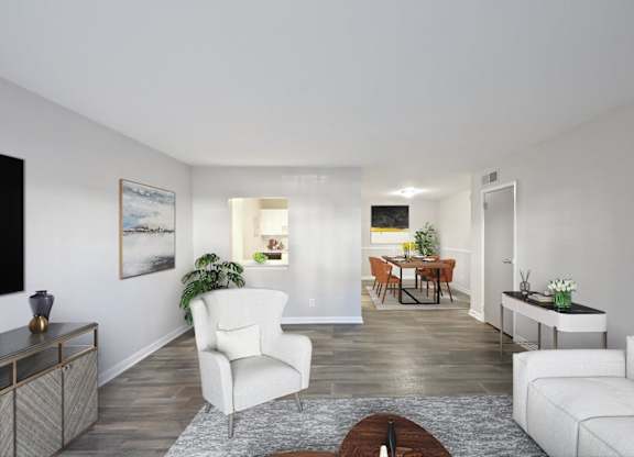 A living room with a white chair and a brown coffee table.
