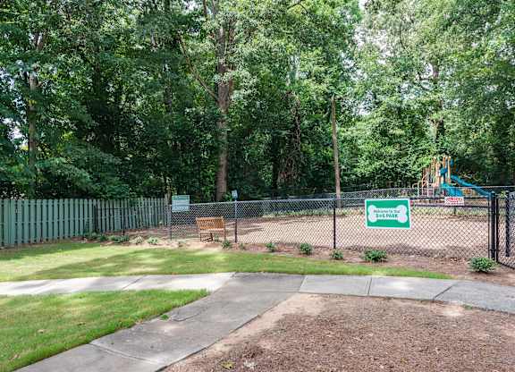 A sign in a park reads "Sunset".