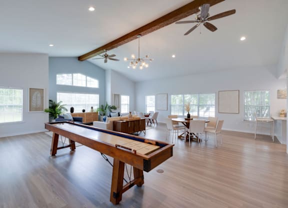 A spacious room with a long wooden table and chairs at Retreat at Savannah Apartments, Savannah, GA, 31404