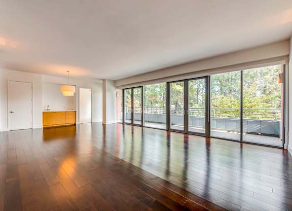 A room with wooden floors and a yellow bench.at Catania, Pasadena California