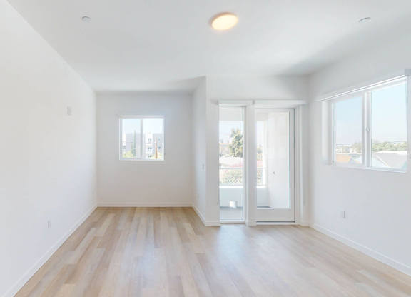 A spacious room with wooden floors and white walls.at The Dillon II at Silver Lake, California, 90026