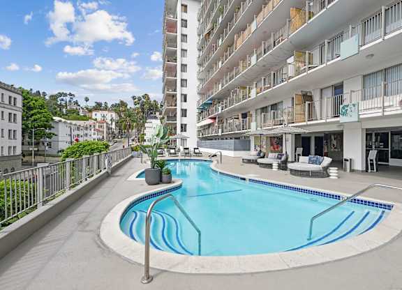 A small pool on a balcony of a building.