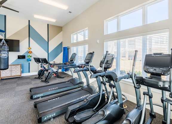 Gym with elliptical machines at Leland Station Apartments, Leland, NC, 28451