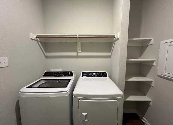 Two Front Loading Washing Machines at Cottages at Beltmill Apartments, Texas