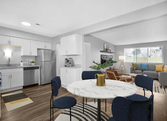 A modern kitchen with a dining table set for four.