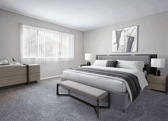Bedroom with a large bed, nightstands, and a bench at Versailles, 25026 E Rue Versailles, Oak Park, MI 48237