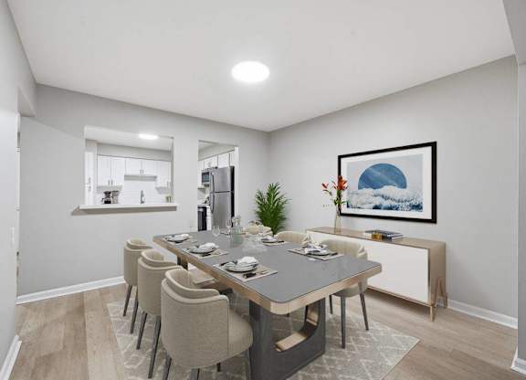 A dining room with a table set for six.