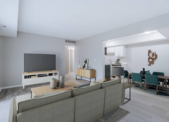 A modern living room with a grey sofa and a television.