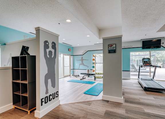 A gym with a focus sign on the wall.