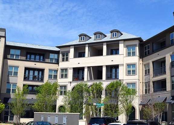 Building with balconies and a sidewalk at Civic at Frisco Square Apartments, Frisco, Texas