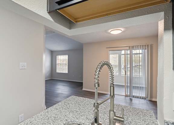 A kitchen with a sink and a window.