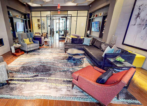 Club Room With Large Screen Tvs And A Fireplace at Civic at Frisco Square Apartments, Frisco, TX, Texas