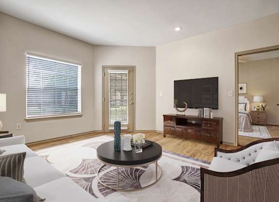A living room with a black coffee table and a white sofa.