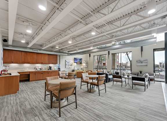 A modern office space with wooden furniture and a large window.