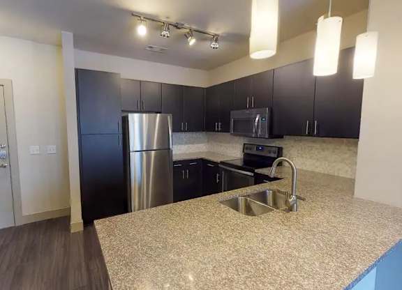 Kitchen With Custom Maple Cabinetry at Civic at Frisco Square Apartments, Frisco, 75034