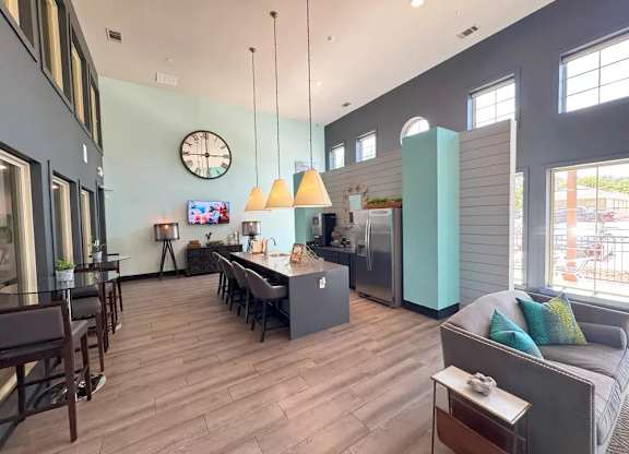 A modern kitchen with a dining table and chairs.