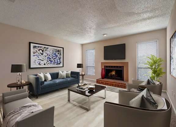 A living room with a fireplace and a television.