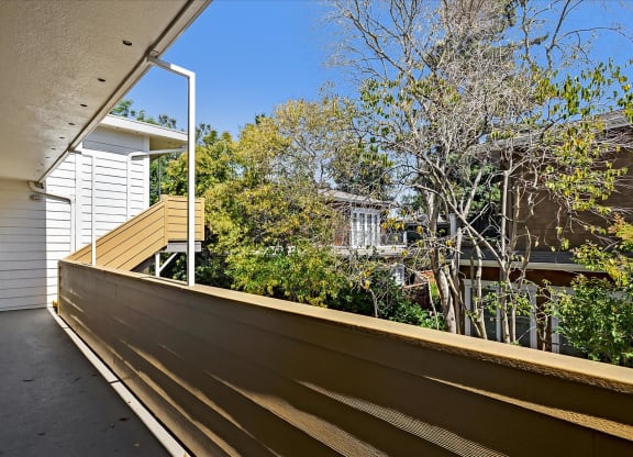the deck has a view of the yard and the house