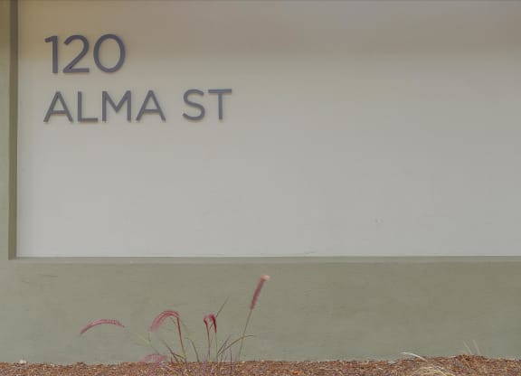 A sign that says 120 Alma St.