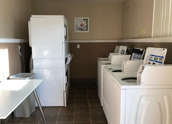 a kitchen with a bunch of white appliances in it
