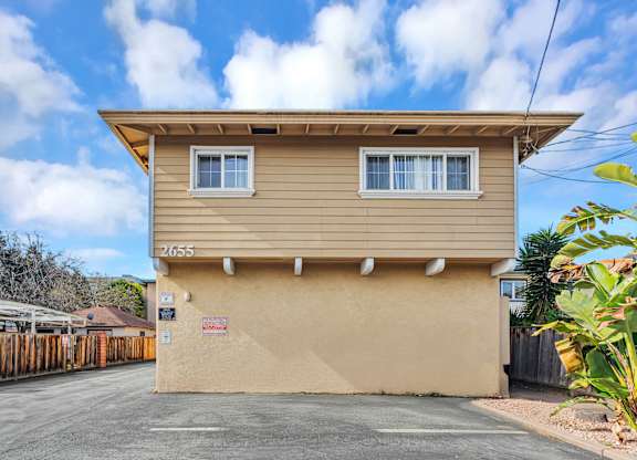 A two-story house with a garage is numbered 2655.