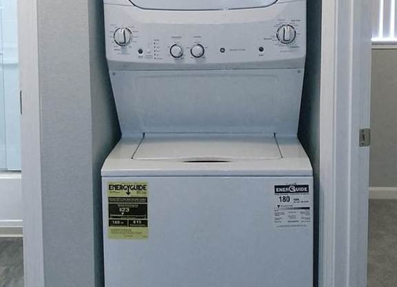 A white fridge with a sign above it that says "SOAP & WATER".
