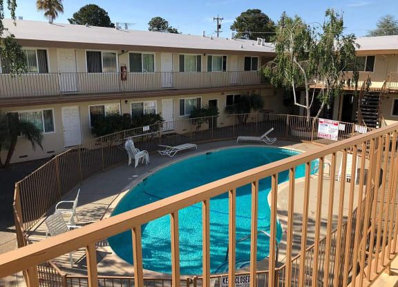 a view of a swimming pool from a balcony