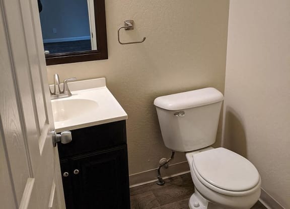 a bathroom with a toilet and a sink