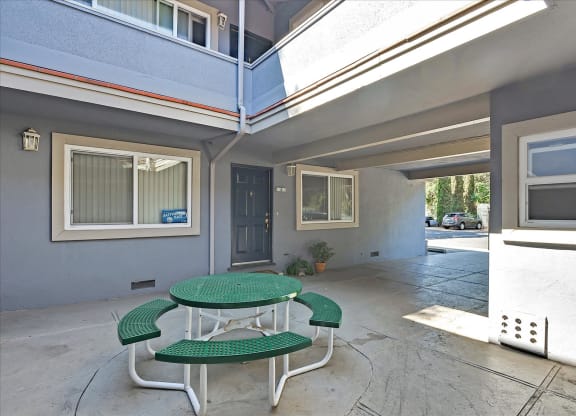A patio with a table and chairs is shown.