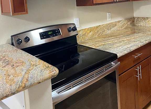 a kitchen with a stove and a microwave