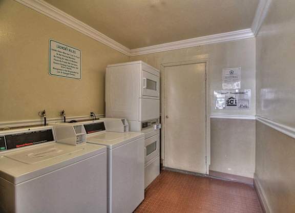 A laundry room with a washer and dryer.