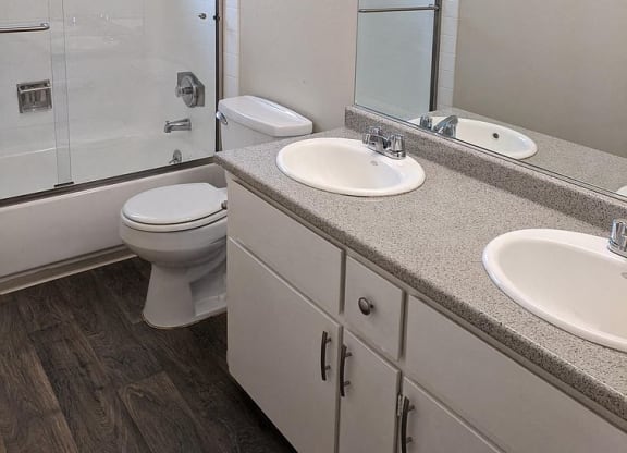 a bathroom with a toilet sink and a shower