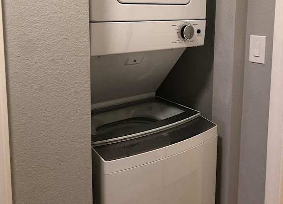 A white dishwasher is installed in a kitchen.