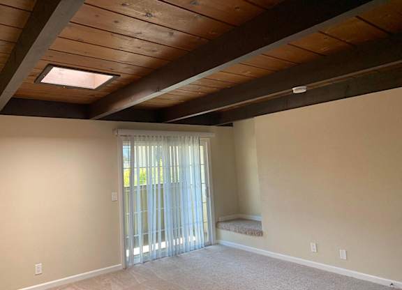 a living room with a sliding glass door