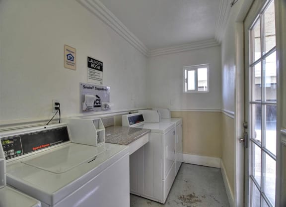 A laundry room with a washer and dryer.
