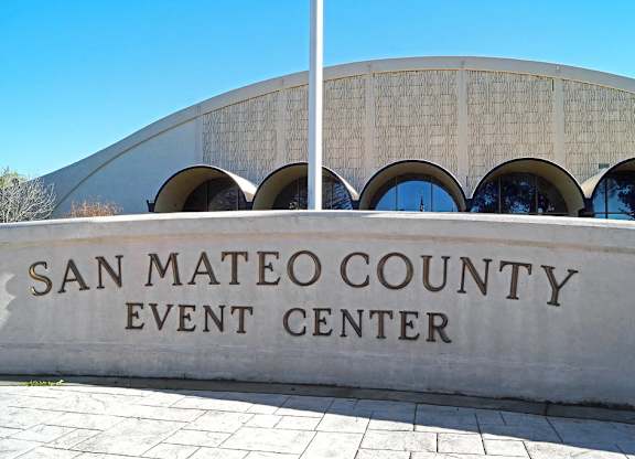 the exterior of the county event center in front of a building
