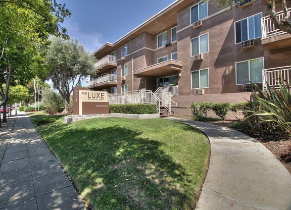 the Luxe building exterior view with walk paths at The Luxe, California, 95051