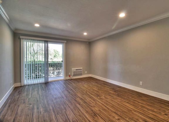 Living room with glass door view at The Luxe, Santa Clara, CA, 95051