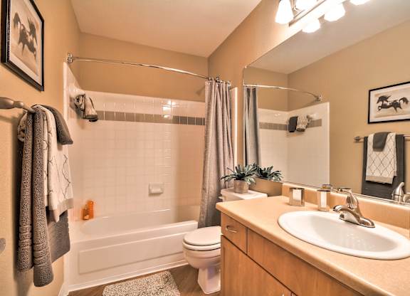 Modern bathroom with vanity and mirror at Rosemeade Apartments, Roseville, CA 95661