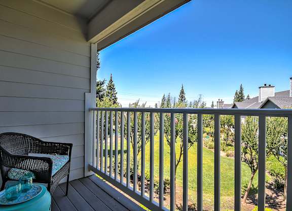 Covered balcony overlooking landscaped green space at Rosemeade Apartments, Roseville, 95661