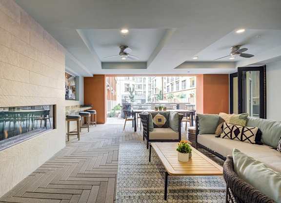 Living room with a fireplace and couch at Renaissance Square, Concord