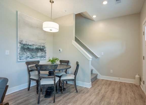 A dining room with a table and chairs at Ventura Townhouses, Michigan, 49460