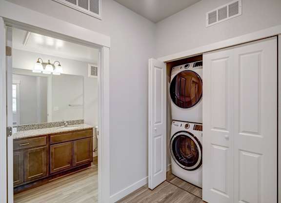 A laundry room with a washer and dryer in it.