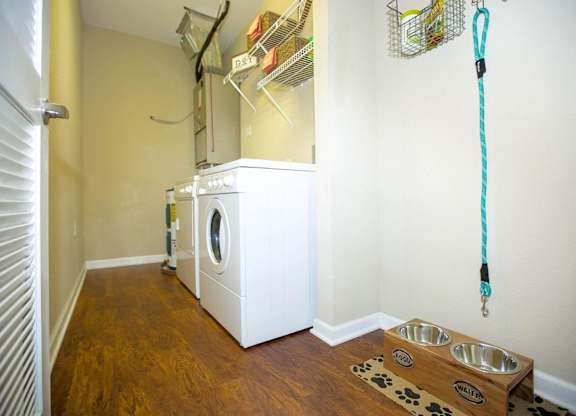 A laundry room with a washer and dryer.
