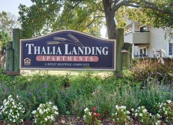 A sign for Thalia Landing Apartments in a Ripley Heatho community.